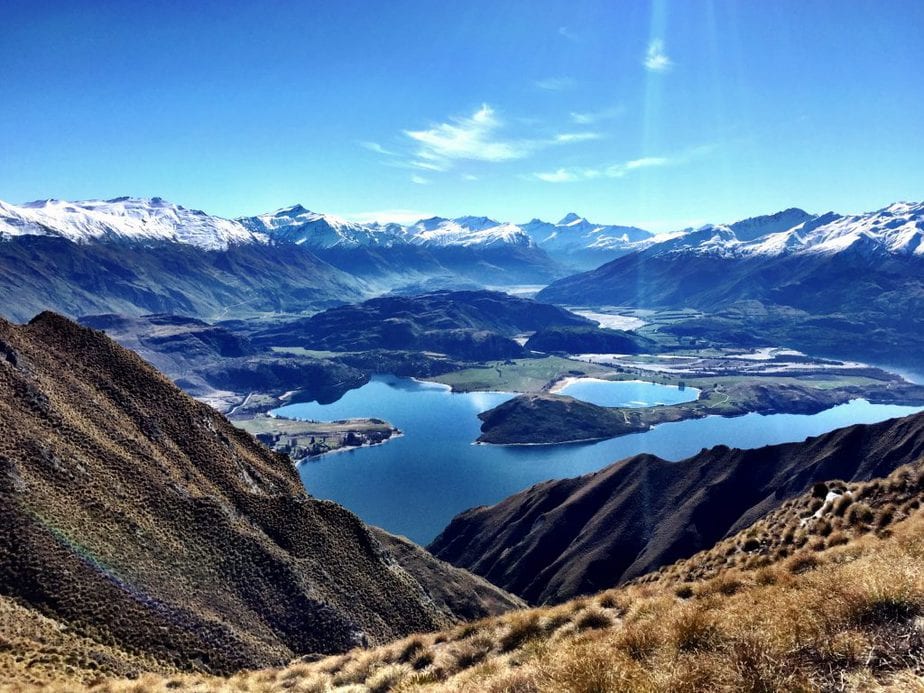 View of Lake Wanaka and the snow covered mountain range from the top of Roy's Peak