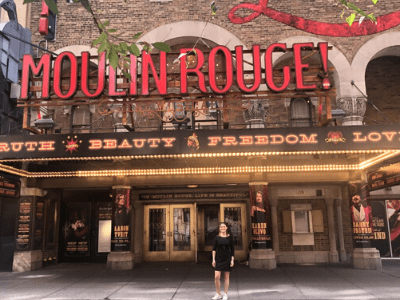 Outside the Moulin Rouge Theatre with large Marquee Sign